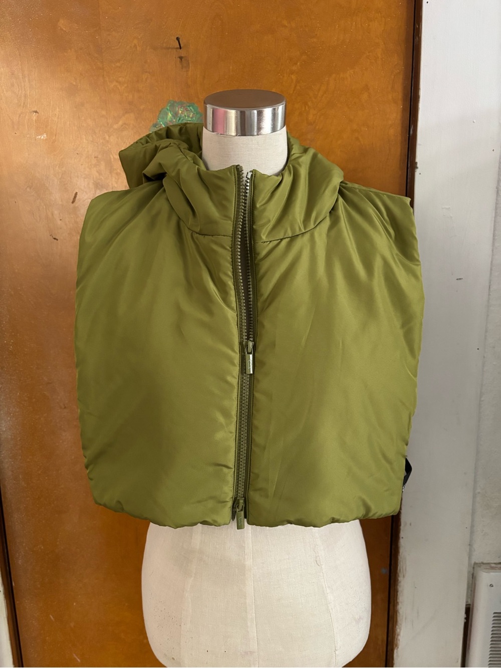 Cropped puffer vest.  Non detachable hood